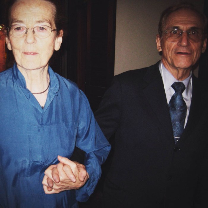 dressed up old couple holding hands on bourbon street